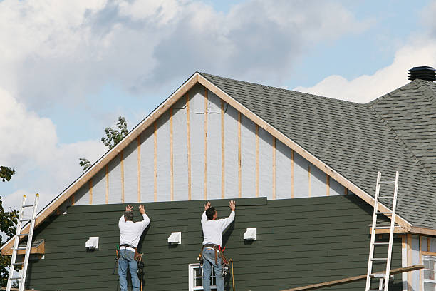 Professional Siding technician working in Durham, CT